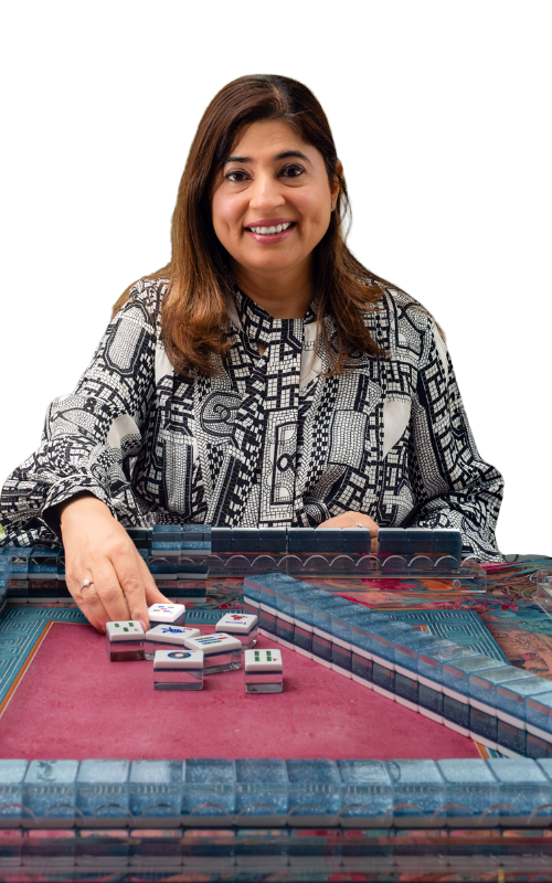 Hashmat Pereira with Mahjong tiles at table